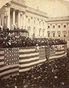 A large crowd of people outside the United States Capitol building