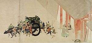 An ox-drawn cart surrounded by warriors in front of a gate as if departing. A priest standing in the gate is pointing at the cart.