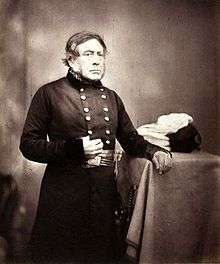 Photograph of Sir Henry John William Bentinck, three-quarter portrait, standing, facing right with hand in shirt