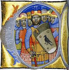Seven armed men, one of the wearing a shield depicting a bird of prey