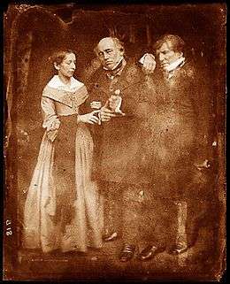 middle-aged woman and two elderly men