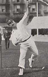 A cricketer bowling