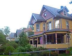 Oblique front view of several Victorian houses