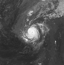 A satellite image depicting a small tropical cyclone in the eastern Atlantic Ocean.