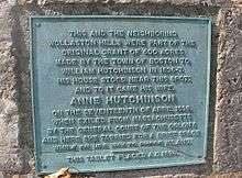 Photograph of historical plaque affixed to a rock describing Anne Hutchinnson property now in Quincy, Massachusetts