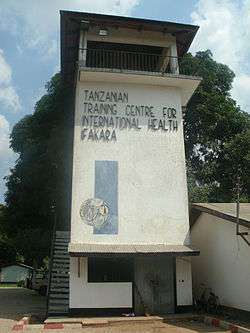 Tower reads, "Tanzanian Training Centre for International Health, Ifakara".