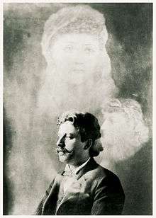 Promotional image of J Randall Brown supposedly surrounded by ghosts.