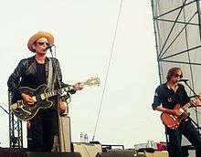 Photo of Jakob Dylan and Stuart Mathis of The Wallflowers performing in Minnesota in 2014