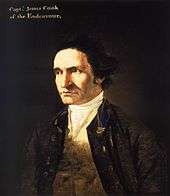  Severe-looking man, clean-shaven and with a high forehead, wearing an open coat, white shirt and embroidered waistcoat. A legend in the top left corner identifies him as "Capt. James Cook of the Endeavour".