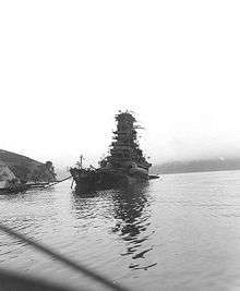 a heavily damaged Haruna, having sunk from the stern, several days after coming under attack at her moorings