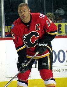 Iginla stands near the boards, without his helmet, during a pre-game warm-up.