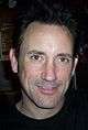 A closeup of Jimmy Chamberlin—a middle-aged Caucasian male—smiling