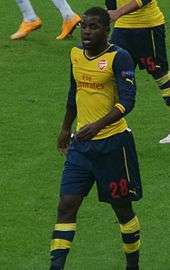 A colour photograph of Joel Campbell, in action for Arsenal in a Premier League game.