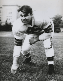 A photo of John Kissell in a three-point stance in a Cleveland Browns number 45 uniform