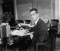 John V.A. MacMurray sitting at his desk in the U.S. Department of State