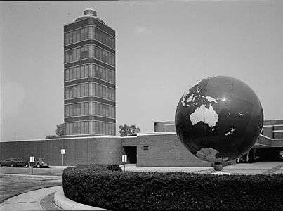The Johnson Wax building with a large globe in the foreground