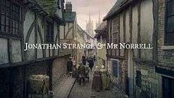 Series title over a 19th century street scene
