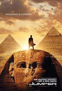 Movie poster with the Egyptian Sphinx monument at the bottom of the image and two pyramids visible in the background. A man is standing on top of the Sphinx's head, facing forward. Sunlight behind him makes it difficult to see most details. The sky has multiple clouds, and at the top of the image is the tagline "anywhere is possible." At the bottom of the image is the film's title and website for the film.