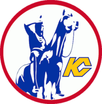Inside a circle with a red border, a statue of a Native American scout riding a horse, and a monogram joining the letters K and C in yellow.
