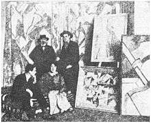 Cuthbert Hamilton (seated), Kate Lechmere, Edward Wadsworth and Wyndham Lewis at the Rebel Art Centre, March 1914.