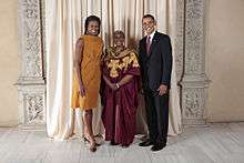 Photograph of U.S. President Barack Obama and First Lady Michelle Obama at the Metropolitan Museum of Art with Olubanke King Akerele in 2009