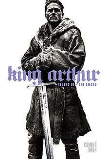 King Arthur standing in a grand pose with Excalibur