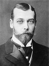 Portrait photo of a young George V with a beard and moustache