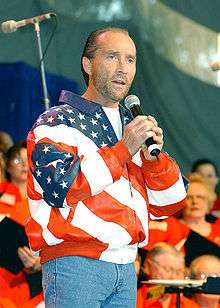 Man performing in a Stars and Stripes jacket