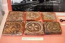 Six decorated medieval terracotta floor tiles, excavated at the abbey