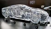Translucent glass model in the shape of a coupe.