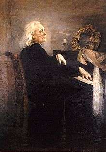An old man with long hair, wearing a cassock, playing the piano