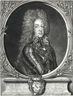 Black and white print of a man wearing armor. He wears an enormous wig of tightly curled hair that flows down to his shoulders and gives him the appearance of having a narrow head.