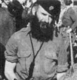 male in uniform with large beard