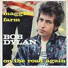 Single sleeve of Dylan in a blue jacket staring at the camera with a person standing behind him, his name and large song titles.