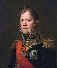 Portrait of a red-headed man in a dark blue early 19th century military uniform with a red sash and lots of gold braid