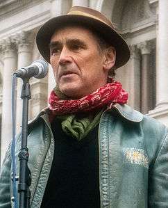A photograph of Mark Rylance speaking at a Stop the War protest in London in 2015