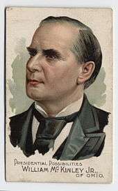 A cigarette card bearing a colour image of a politician, denoted to be "William McKinley Jr of Ohio"; the grey-haired man's head points to the left with a neutral expression.