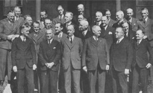 A group of men in suits pose for a picture.