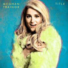 A portrait of Meghan Trainor sporting a green fur jacket, posing afront a blue backdrop, with her name and the title, "Title" appearing in the portrait's corners.