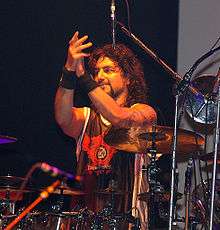 Mike Portnoy behind a line of splash cymbals