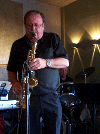 Burney playing saxophone live