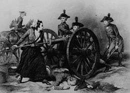 Black and white print shows a woman using a rammer to swab out a cannon as three men in the gun crew and a man on horseback look on.