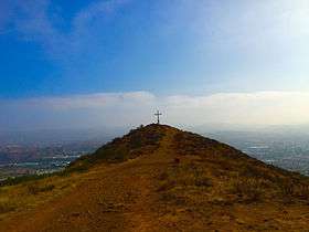 The cross on Mount McCoy with Simi Valley in distance.