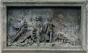 Plaque showing Napoleon sighting a cannon at the Battle of Montereau.