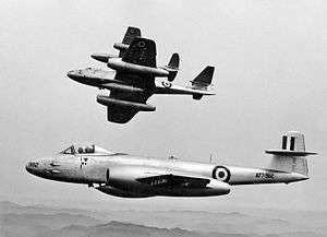 Three twin-engined, single-seat jet fighters in flight