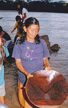 Woman mining gold in the Amazon river in Ecuador, 2014.