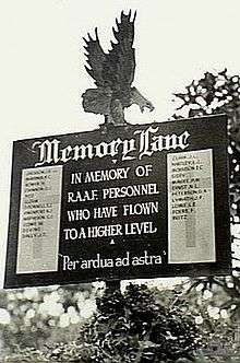 Sign with an eagle on top, reading "Memory Lane In memory of R.A.A.F personnel who have flown to a higher level 'Per ardua ad astra'", and a list of those killed