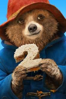 Paddington Bear holding a sandwich shaped like a "2"