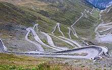 A mountain pass with paved roads.