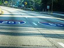 Interstate Shields for I-283 and I-83 painted on the roadway.